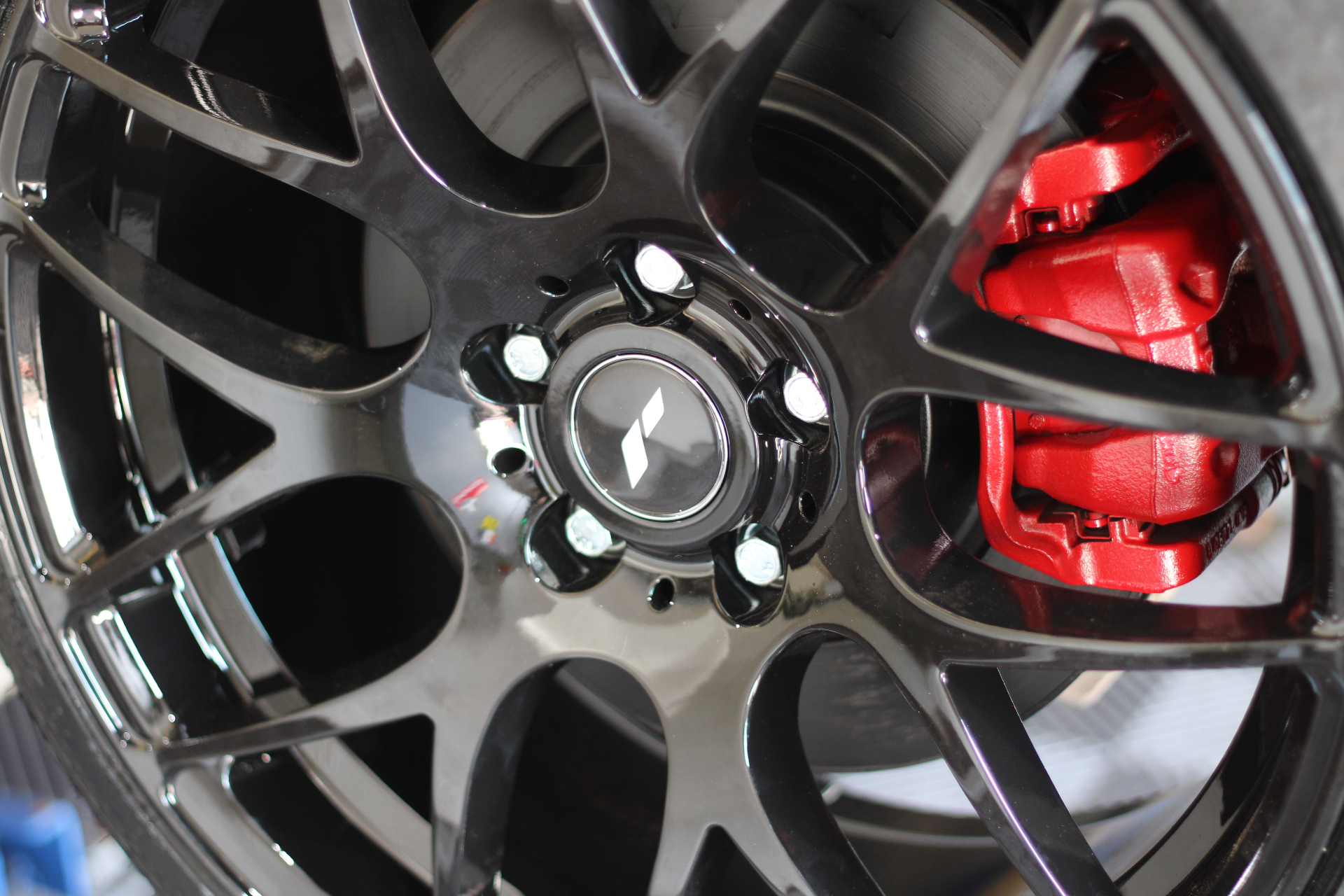 Black alloy with red brake caliper